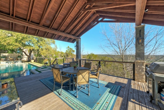 deck with a fenced in pool