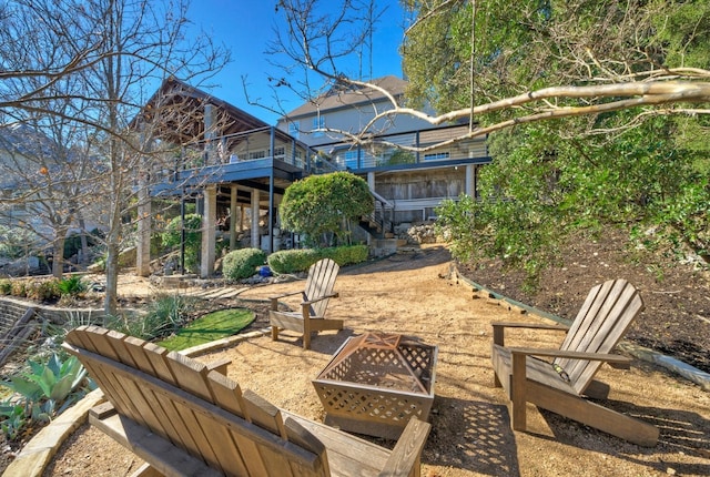 view of yard with an outdoor fire pit