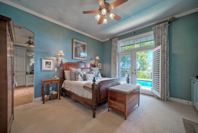 carpeted bedroom featuring ornamental molding, access to exterior, ceiling fan, and french doors