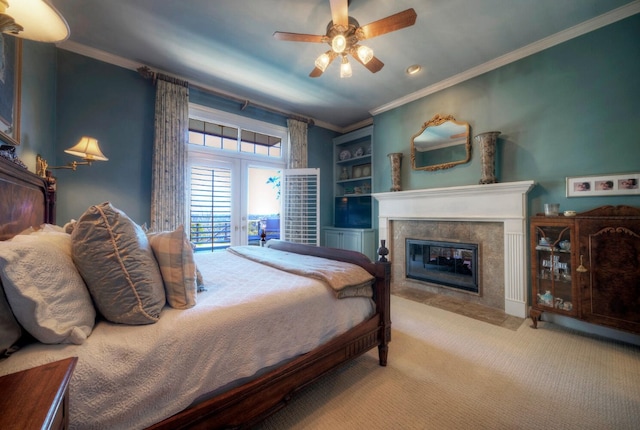 carpeted bedroom with ornamental molding, access to exterior, ceiling fan, and french doors