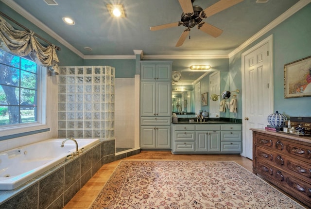 bathroom with ornamental molding, vanity, separate shower and tub, and hardwood / wood-style floors