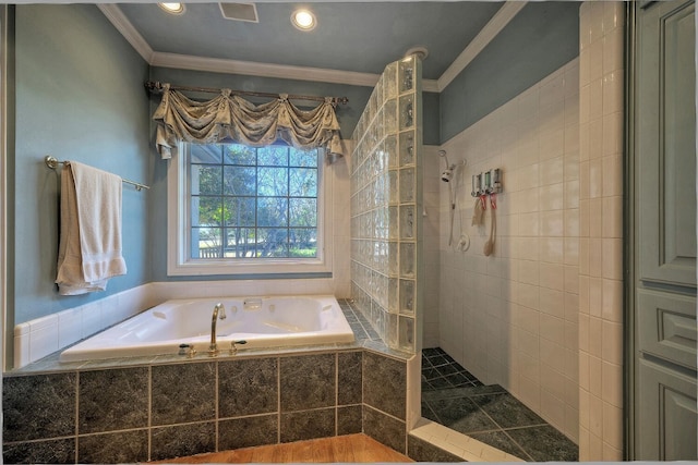 bathroom with ornamental molding and plus walk in shower