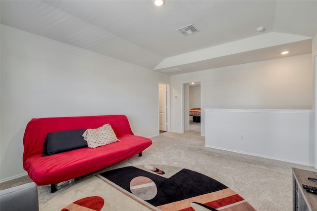 living room featuring lofted ceiling and light colored carpet