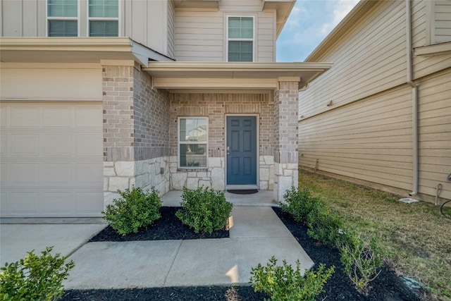 doorway to property featuring a garage