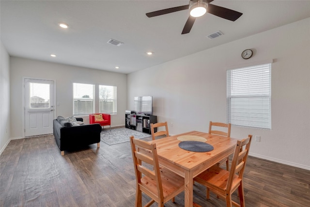 dining room with dark wood-type flooring and ceiling fan