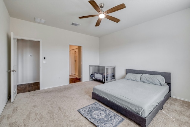 carpeted bedroom featuring ceiling fan