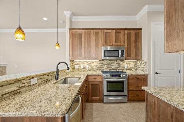 kitchen featuring sink, appliances with stainless steel finishes, light stone counters, tasteful backsplash, and decorative light fixtures