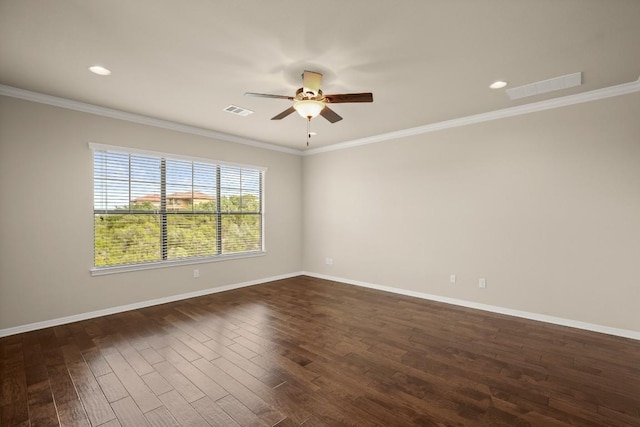 spare room with dark hardwood / wood-style flooring, ornamental molding, and ceiling fan