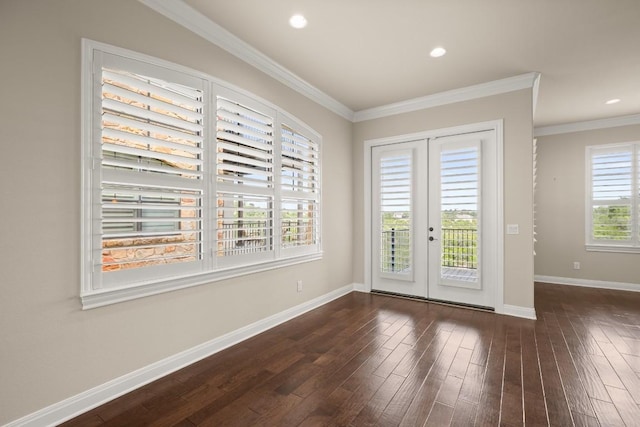 doorway with crown molding, dark hardwood / wood-style floors, and french doors