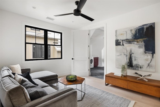 2709 Stacy Ln Unit 1, Austin, TX 78704 - living room with ceiling fan and washer / dryer