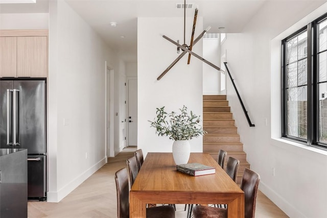 2709 Stacy Ln Unit 1, Austin, TX 78704 - dining area featuring healthy amount of natural light, baseboards, and stairway