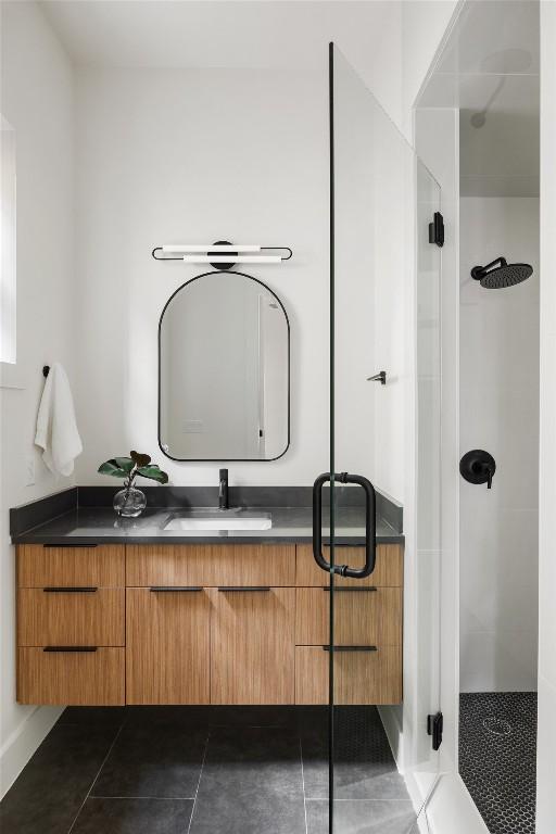 2709 Stacy Ln Unit 1, Austin, TX 78704 - full bath with a stall shower, vanity, and tile patterned flooring