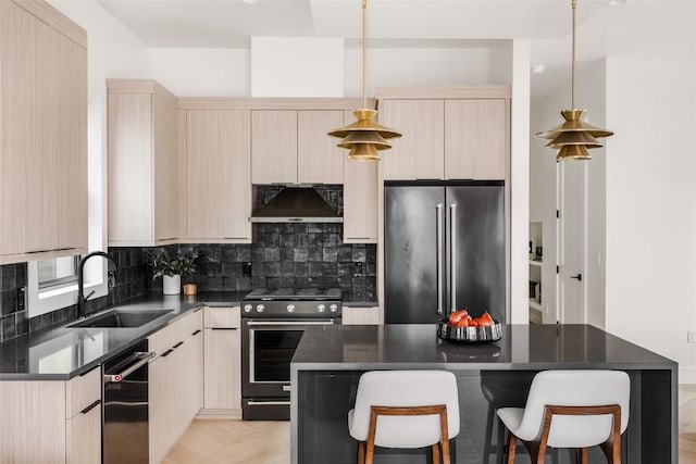 2709 Stacy Ln Unit 1, Austin, TX 78704 - kitchen with appliances with stainless steel finishes, exhaust hood, dark countertops, tasteful backsplash, and light brown cabinetry