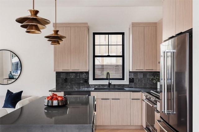 2709 Stacy Ln Unit 1, Austin, TX 78704 - kitchen with high quality appliances, a sink, light brown cabinets, dark countertops, and modern cabinets