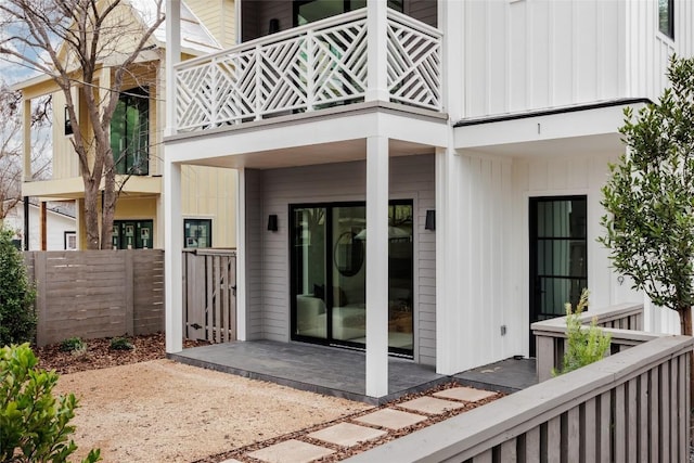 2709 Stacy Ln Unit 1, Austin, TX 78704 - doorway to property featuring a balcony, a patio, and board and batten siding