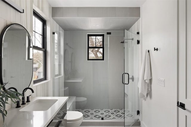 2709 Stacy Ln Unit 1, Austin, TX 78704 - bathroom featuring toilet, a stall shower, vanity, and plenty of natural light