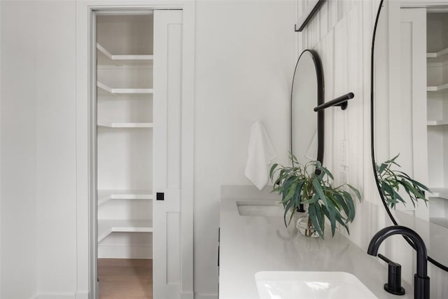2709 Stacy Ln Unit 1, Austin, TX 78704 - bathroom with wood finished floors and double vanity