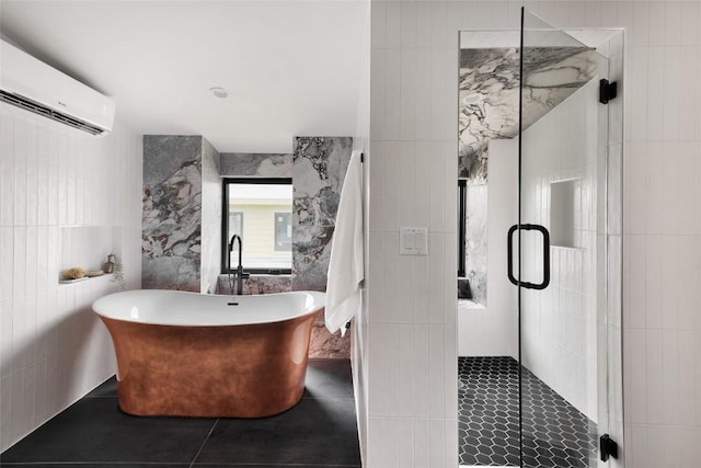 2709 Stacy Ln Unit 1, Austin, TX 78704 - full bath featuring a wall mounted AC, tile walls, a shower stall, tile patterned flooring, and a freestanding bath
