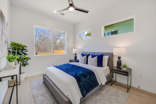 bedroom featuring ceiling fan and light hardwood / wood-style floors