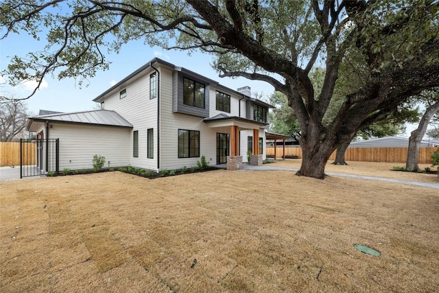 3008 W 50th St, Austin, TX 78731 - view of front facade featuring a chimney and a metal roof