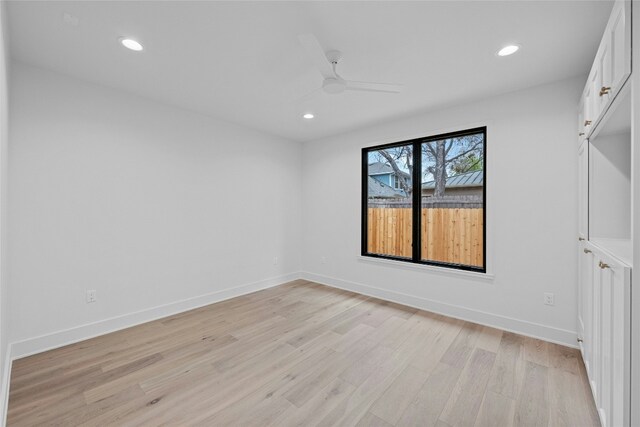 spare room with ceiling fan and light hardwood / wood-style flooring