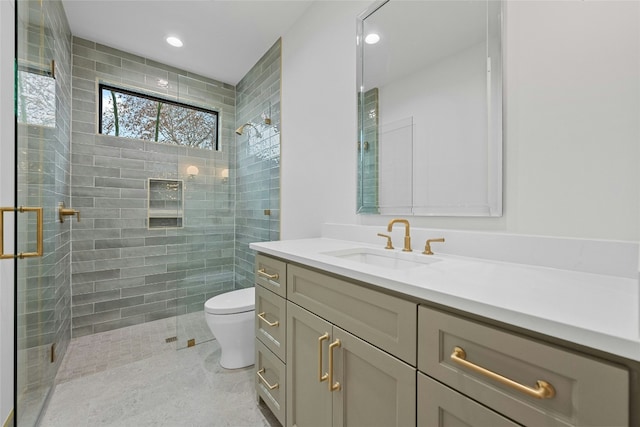 bathroom with walk in shower, vanity, toilet, and tile patterned flooring