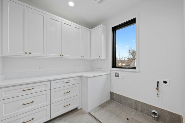 3008 W 50th St, Austin, TX 78731 - laundry area with hookup for an electric dryer, cabinet space, and hookup for a gas dryer