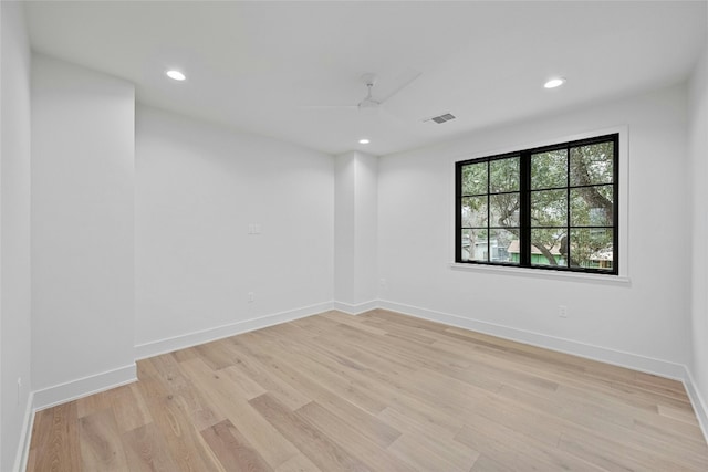 unfurnished room featuring ceiling fan and light hardwood / wood-style floors