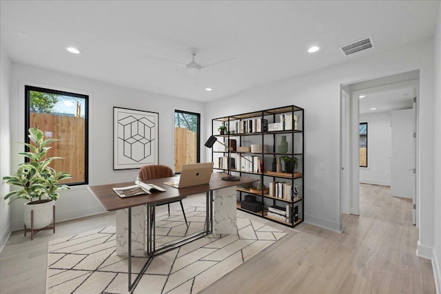 3008 W 50th St, Austin, TX 78731 - home office with plenty of natural light, a ceiling fan, light wood-type flooring, and recessed lighting