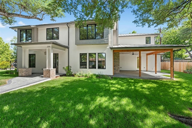 3008 W 50th St, Austin, TX 78731 - back of house with a patio, ceiling fan, a standing seam roof, and a metal roof