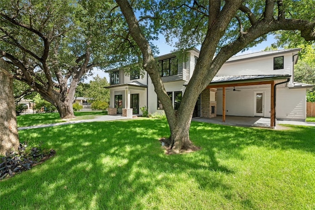 3008 W 50th St, Austin, TX 78731 - rear view of property with a patio area, a ceiling fan, and a lawn