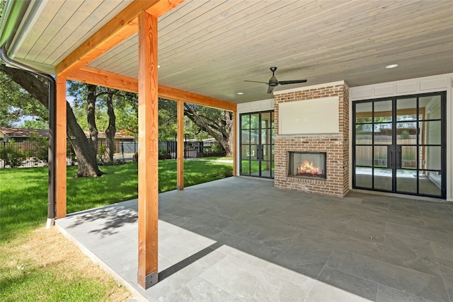 3008 W 50th St, Austin, TX 78731 - view of patio / terrace featuring an outdoor brick fireplace, a ceiling fan, and french doors