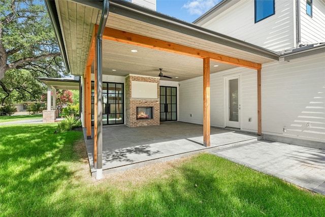 3008 W 50th St, Austin, TX 78731 - view of patio / terrace featuring a fireplace and ceiling fan