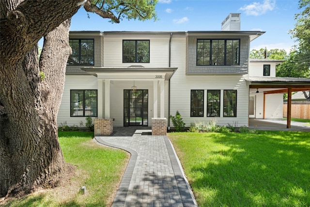 3008 W 50th St, Austin, TX 78731 - view of front of house featuring a chimney and a front lawn