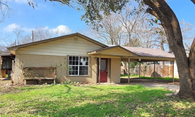 view of front of property with a front yard, a carport, and a deck