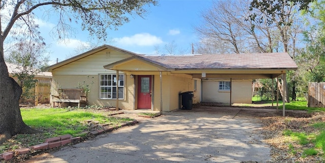 2810 Inwood Rd, Temple, TX 76502 - view of front of home with concrete driveway, brick siding, and a carport