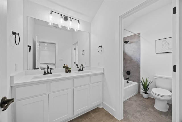 full bathroom featuring vanity, toilet, and tiled shower / bath