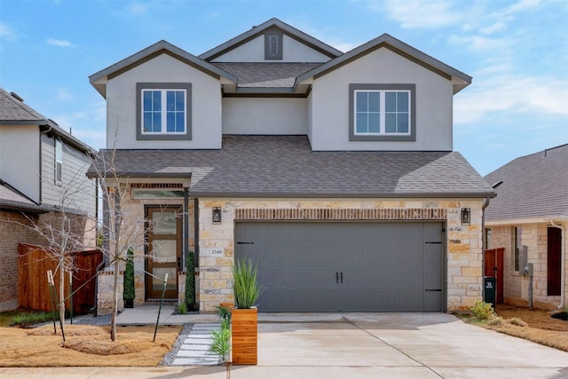 view of front of home featuring stucco siding, stone siding, concrete driveway, and roof with shingles