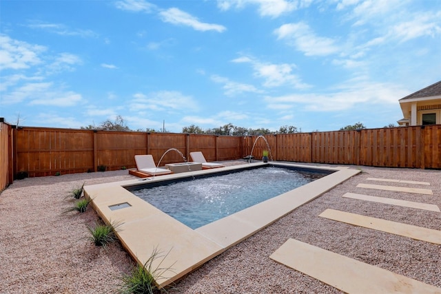 view of pool with a patio area and pool water feature