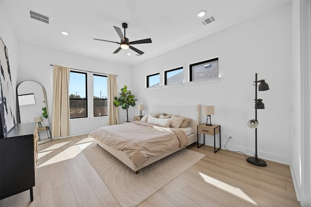 bedroom featuring light hardwood / wood-style flooring and ceiling fan