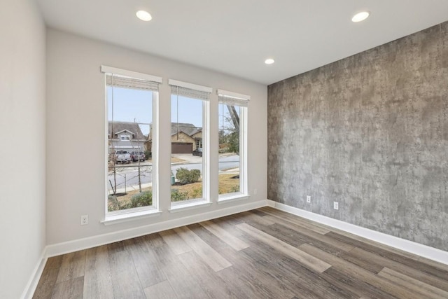 spare room featuring hardwood / wood-style flooring