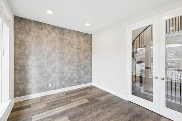 spare room featuring dark wood-type flooring