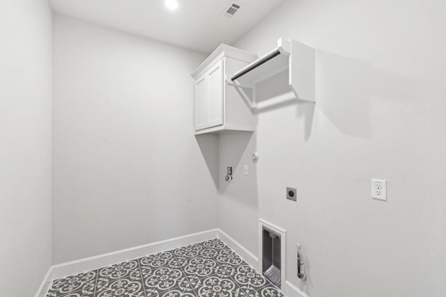 washroom featuring hookup for a gas dryer, hookup for an electric dryer, and cabinets