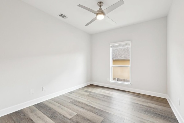 unfurnished room featuring ceiling fan and light wood-type flooring