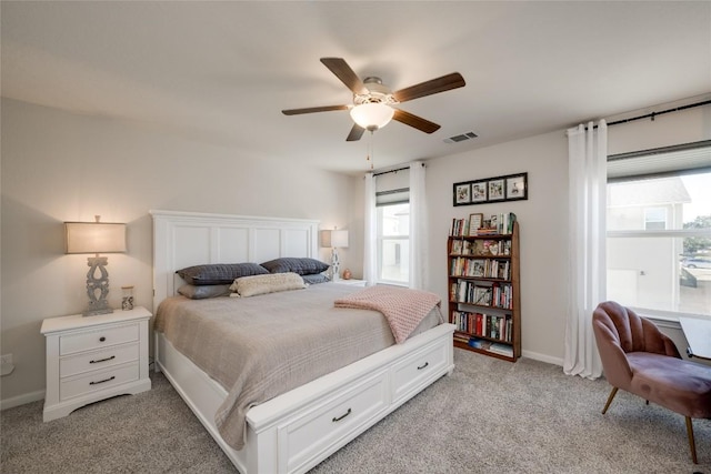 bedroom featuring light carpet and ceiling fan