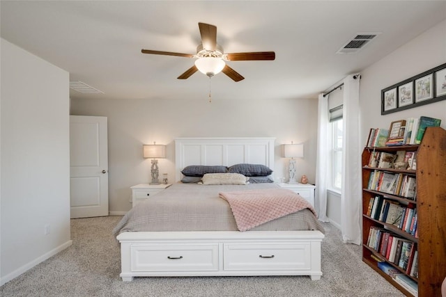 bedroom featuring ceiling fan and light carpet