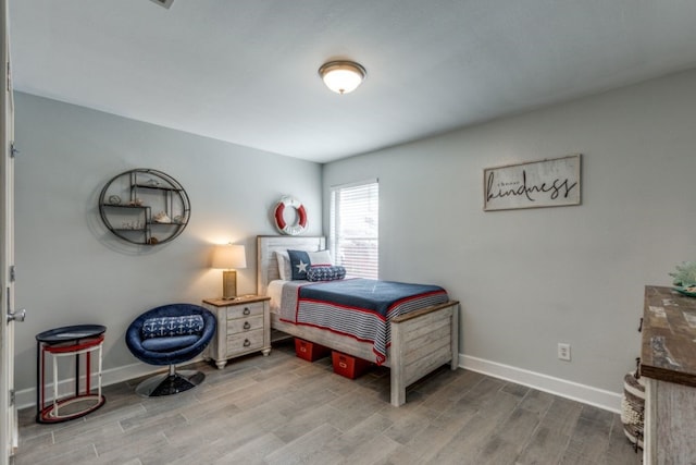 bedroom featuring hardwood / wood-style floors