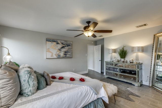 bedroom featuring hardwood / wood-style floors and ceiling fan