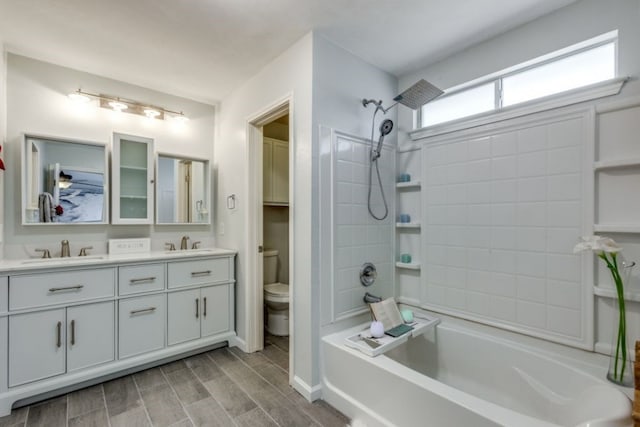 full bathroom featuring vanity, shower / bathtub combination, and toilet