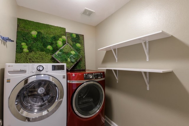 washroom with washer and clothes dryer